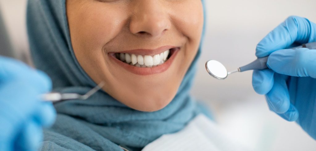Antalya Smile Makeover VIP Transfer Hotel: Experience True Luxury 115 Smile Makeover. Closeup Of Smiling Woman In Hijab During Dental Check Up