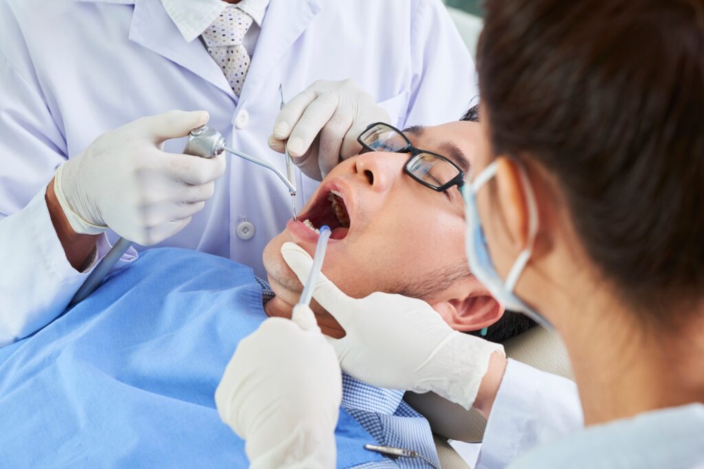 Asian Man Having Dental Surgery